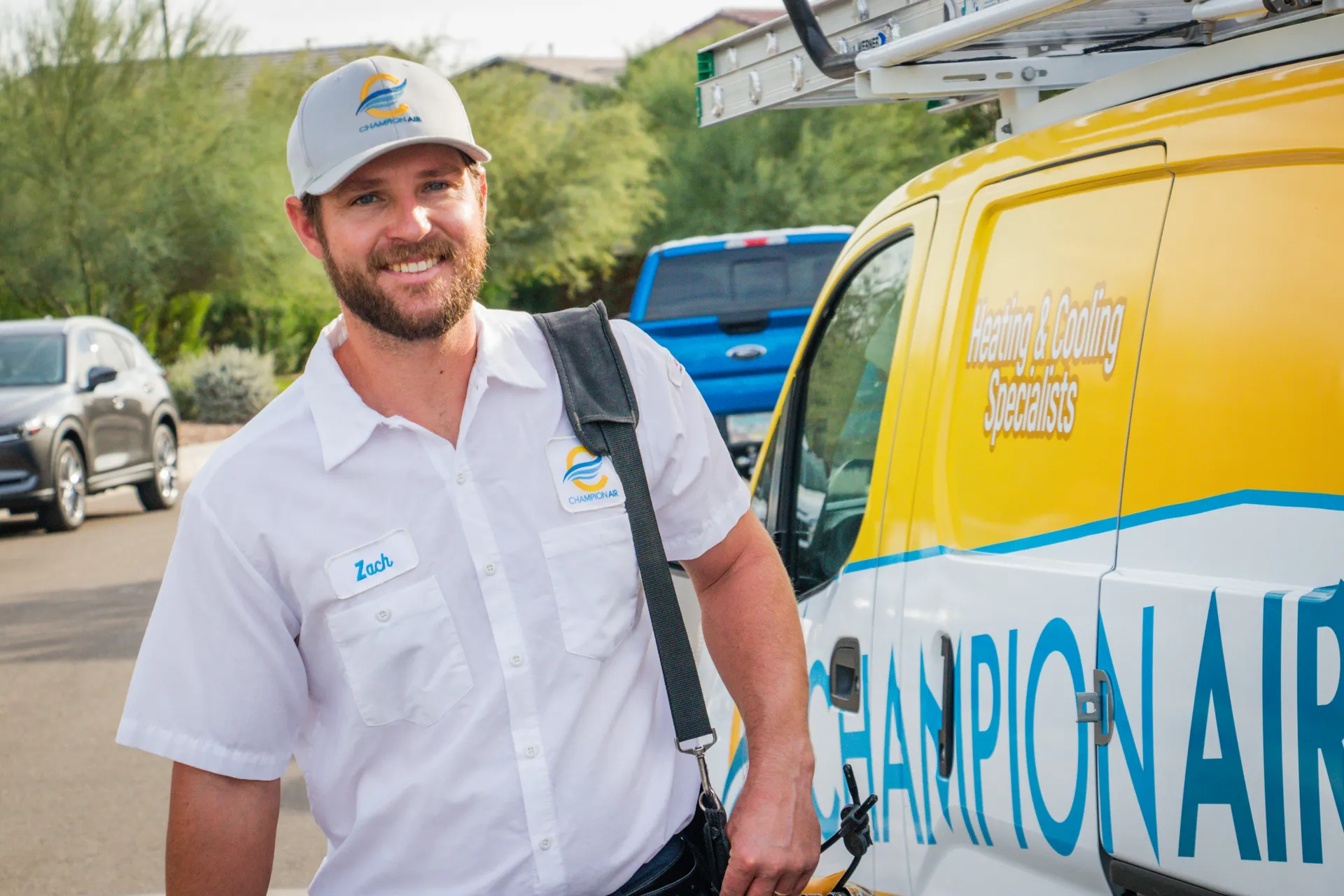 Zach, Champion Air technician, next to the branded service van