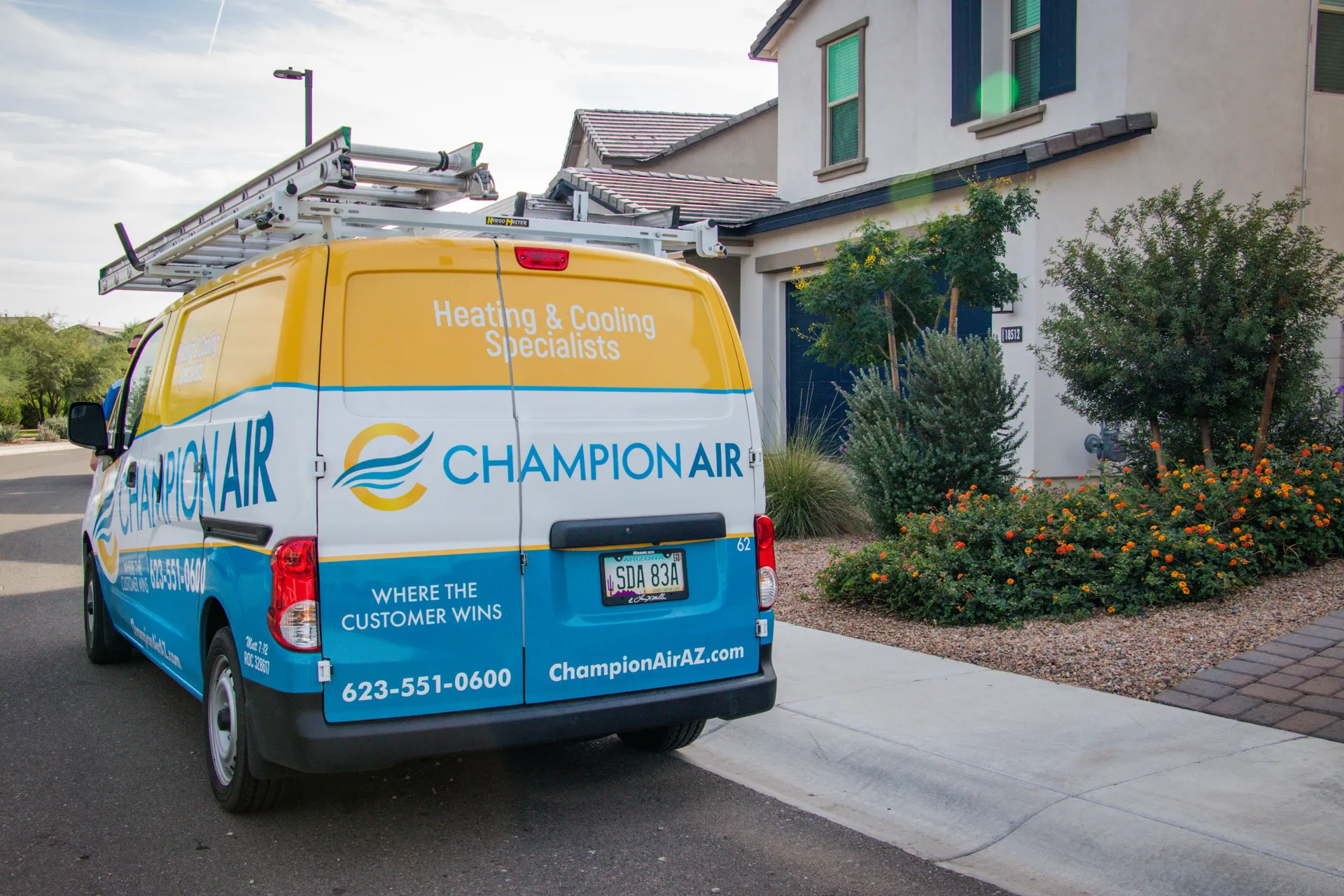 Champion Air service van parked at customer home