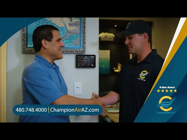 Customer shaking hands with Champion Air technician in a home setting, showcasing HVAC service and customer satisfaction with a digital thermostat displayed in the background.